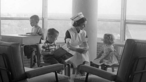 A nurse and children in the Pediatric waiting room on the sixth floor of the University Hospital